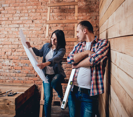 Couple Planning Repairs To Their Home